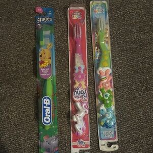 Lot of 3 toothbrushes - Winnie the Pooh, My Little Pony, and Care Bears